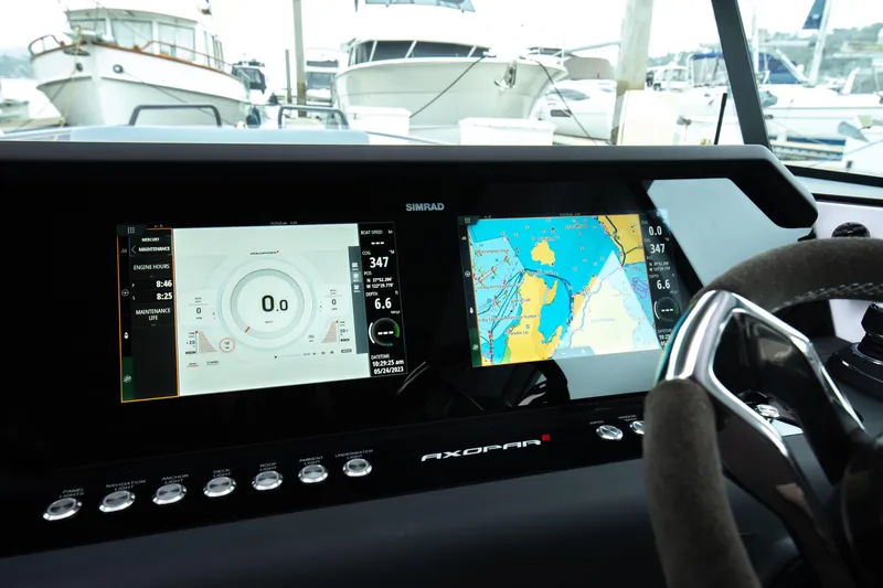 Egret Yacht Photos Pics 2023 Axopar 37 dashboard with navigation and engine displays at marina.