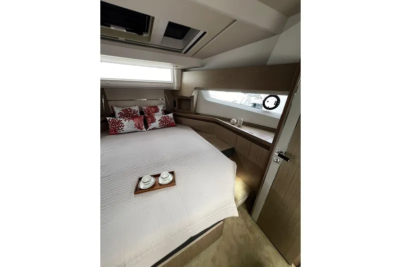 Sealine F430 Yacht Photos Pics Luxurious cabin interior of 2020 Sealine F430 yacht with elegant bedding and decor.