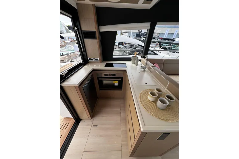 Sealine F430 Yacht Photos Pics Modern kitchen interior of 2020 Sealine F430 yacht with sleek design and appliances.