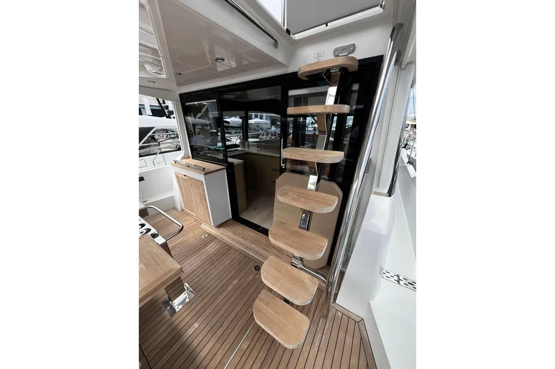 Sealine F430 Yacht Photos Pics Modern interior of 2020 Sealine F430 yacht with wooden steps and sleek design.
