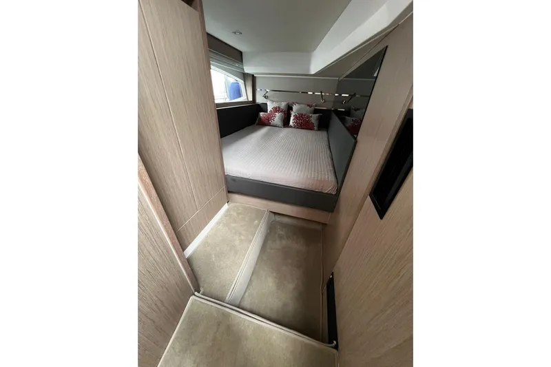Sealine F430 Yacht Photos Pics Luxurious bedroom interior of 2020 Sealine F430 yacht with modern design and cozy bedding.