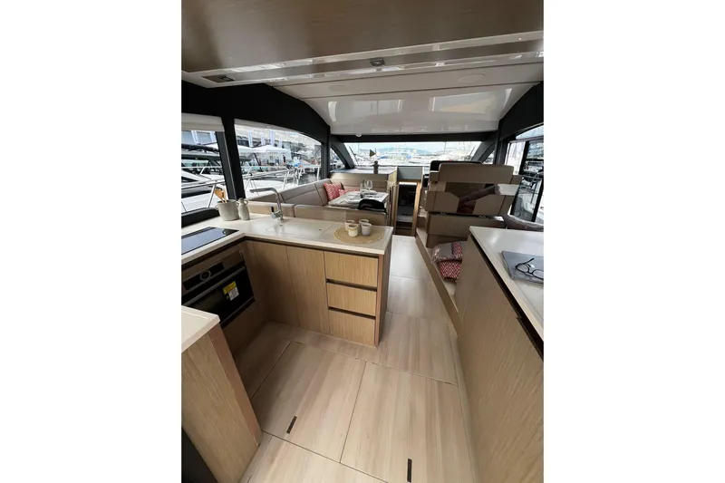 Sealine F430 Yacht Photos Pics Luxurious interior of 2020 Sealine F430 yacht with modern kitchen and seating area.