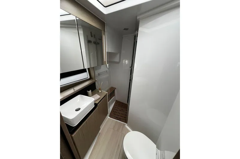 Sealine F430 Yacht Photos Pics Luxurious bathroom in 2020 Sealine F430 yacht with modern fixtures and elegant design.