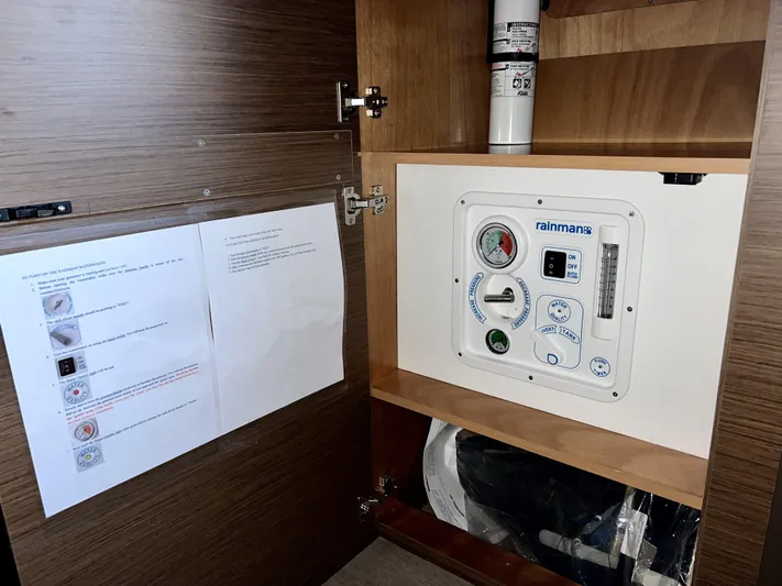 Echo Yacht Photos Pics Control panel inside Lagoon 50 yacht cabinet, featuring Rainman watermaker system, 2023 model.