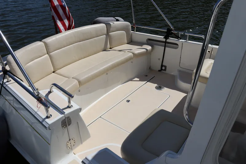 Rambler VIII Yacht Photos Pics 2013 MJM 36z Downeast boat with beige seating and American flag.
