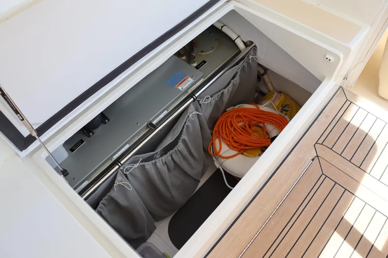 Rambler VIII Yacht Photos Pics Storage compartment on 2013 MJM 36z Downeast boat with equipment and rope.