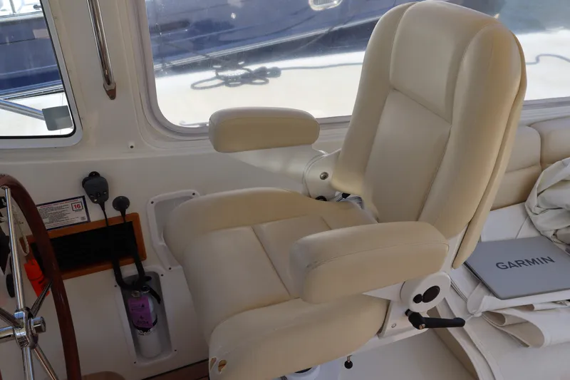 Rambler VIII Yacht Photos Pics Captain's chair in 2013 MJM 36z Downeast boat cockpit, featuring Garmin equipment.