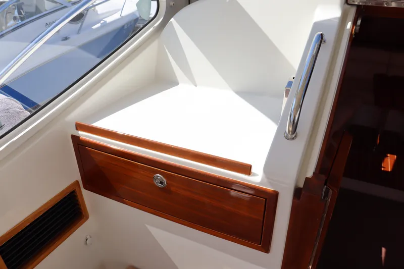 Rambler VIII Yacht Photos Pics Interior of 2013 MJM 36z Downeast boat with wooden storage compartment.