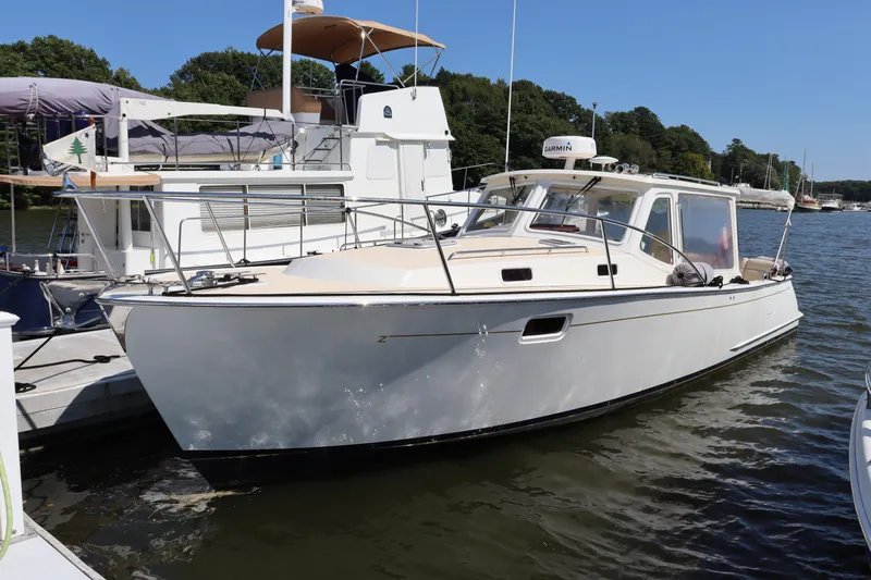 Rambler VIII Yacht Photos Pics 2013 MJM 36z Downeast boat docked on a sunny day.