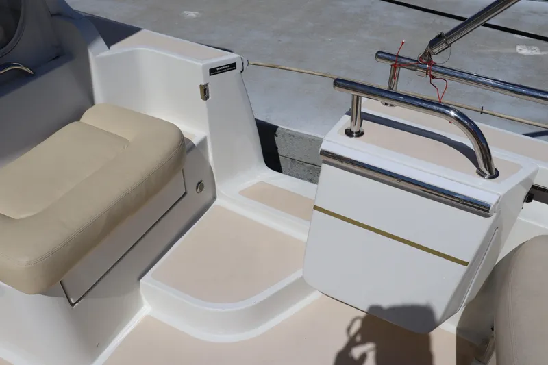 Rambler VIII Yacht Photos Pics 2013 MJM 36z Downeast boat interior with beige seating and stainless steel railing.