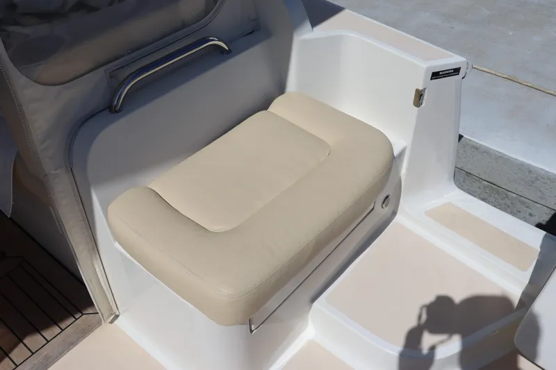 Rambler VIII Yacht Photos Pics Beige seat on 2013 MJM 36z Downeast boat, featuring sleek design and comfort.