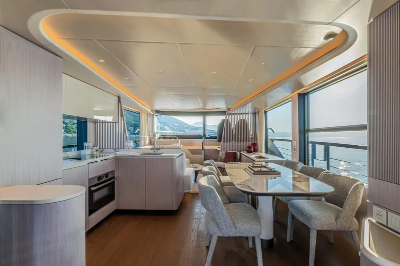  Yacht Photos Pics Luxurious interior of 2026 Absolute Navetta 62 yacht with modern kitchen and dining area.