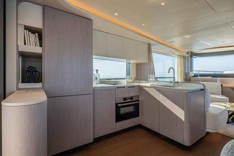  Yacht Photos Pics Luxurious kitchen interior of 2026 Absolute Navetta 62 yacht with modern design and ocean view.