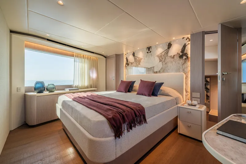  Yacht Photos Pics Luxurious bedroom interior of 2026 Absolute Navetta 62 yacht with elegant decor.