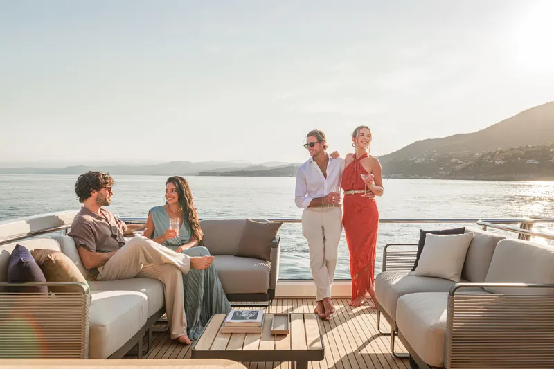  Yacht Photos Pics People enjoying a luxurious cruise on the 2026 Absolute Navetta 62 yacht.