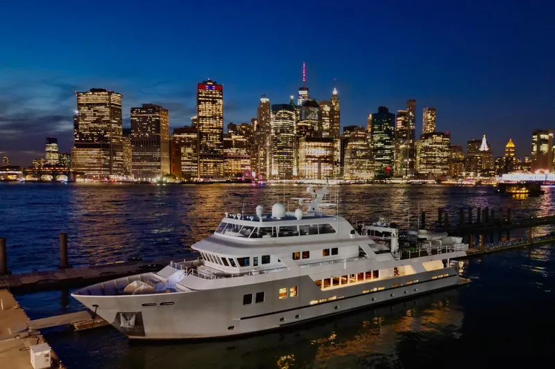 Compass Rose Yacht Photos Pics Luxury yacht docked at night with city skyline; 2011 C & G Boatworks Explorer.