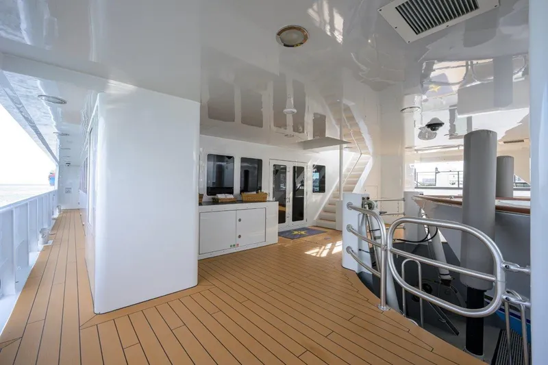 Compass Rose Yacht Photos Pics Spacious deck of 2011 C & G Boatworks Explorer with modern design and wooden flooring.