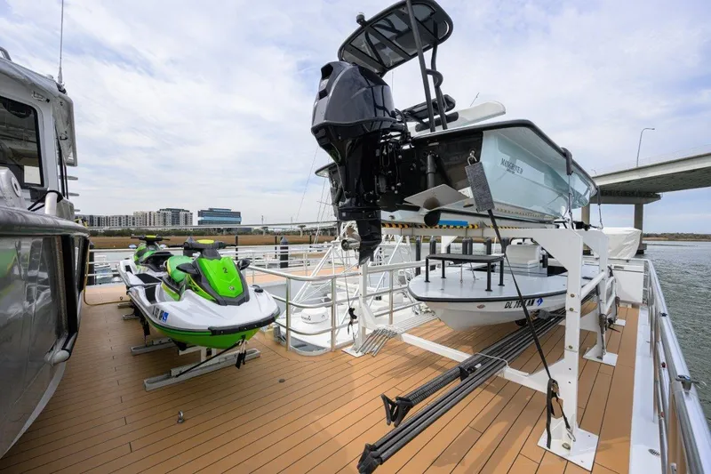 Compass Rose Yacht Photos Pics Deck of 2011 C & G Boatworks Explorer with jet skis and small boat.