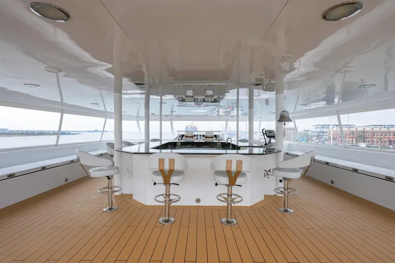 Compass Rose Yacht Photos Pics Luxurious 2011 C & G Boatworks Explorer yacht interior with bar and seating area.