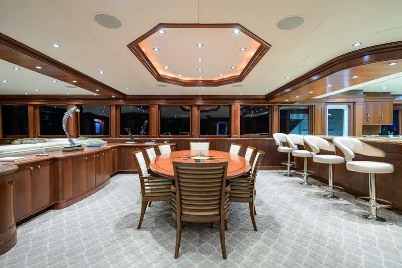 Compass Rose Yacht Photos Pics Luxurious interior of 2011 C & G Boatworks Explorer yacht with elegant dining and bar area.
