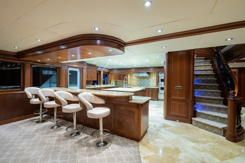 Compass Rose Yacht Photos Pics Luxurious 2011 C & G Boatworks Explorer yacht interior with elegant kitchen and bar seating.