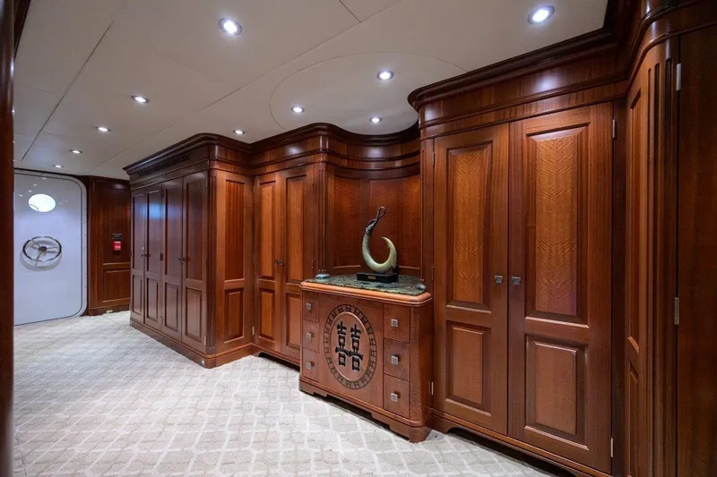 Compass Rose Yacht Photos Pics Luxurious wooden interior of 2011 C & G Boatworks Explorer yacht, featuring elegant cabinetry and sculpture.