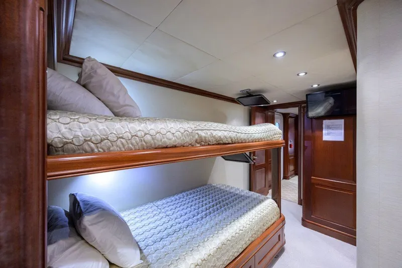 Compass Rose Yacht Photos Pics Interior of 2011 C & G Boatworks Explorer with cozy bunk beds and elegant wood finish.