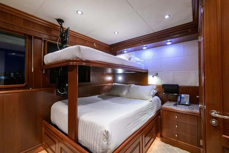 Compass Rose Yacht Photos Pics Luxurious 2011 C & G Boatworks Explorer cabin with wooden interior and bunk beds.
