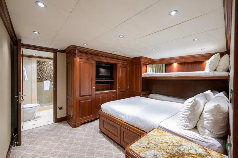 Compass Rose Yacht Photos Pics Luxurious 2011 C & G Boatworks Explorer cabin with wood paneling and ensuite bathroom.