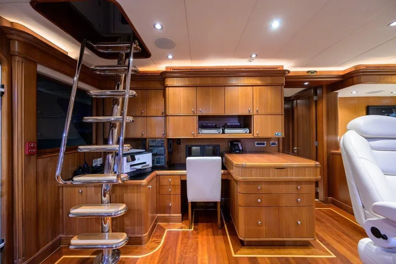 Compass Rose Yacht Photos Pics Luxurious 2011 C & G Boatworks Explorer yacht interior with wooden cabinetry and modern office setup.