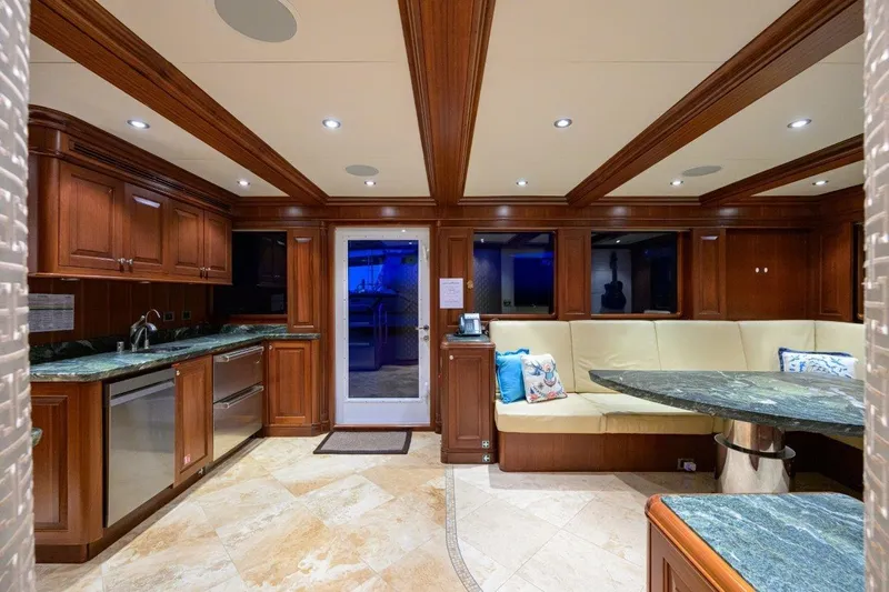 Compass Rose Yacht Photos Pics Luxurious 2011 C & G Boatworks Explorer yacht interior with elegant wood cabinetry and plush seating.
