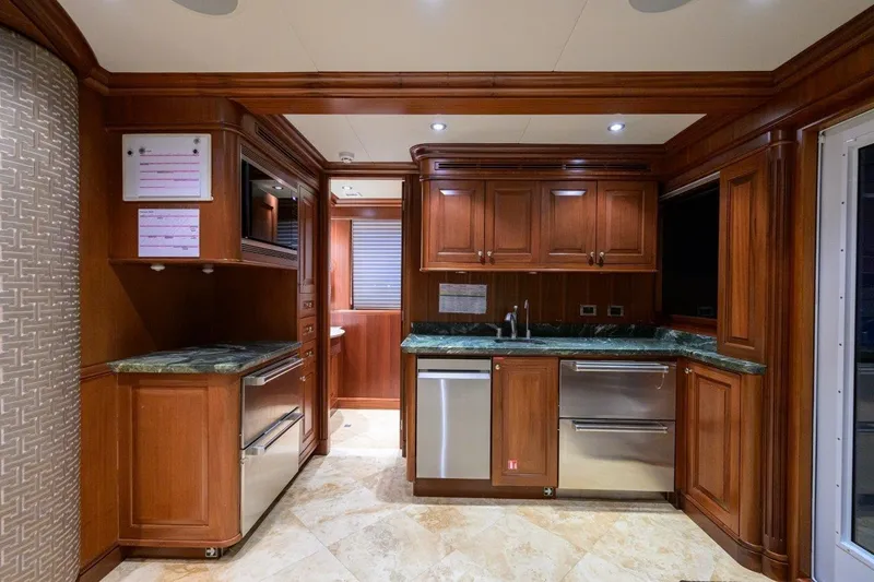 Compass Rose Yacht Photos Pics Luxurious wooden kitchen interior in 2011 C & G Boatworks Explorer yacht.
