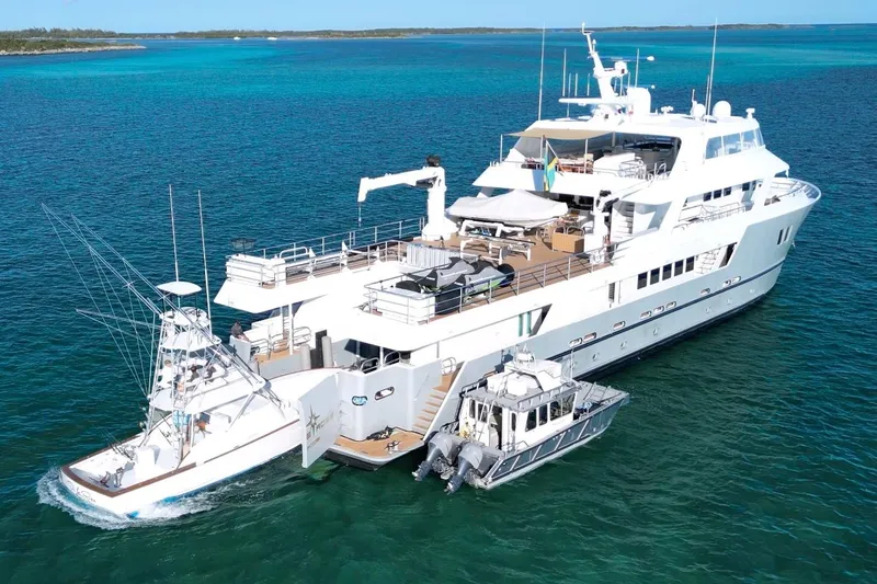 Compass Rose Yacht Photos Pics Luxury yacht "Explorer" by C & G Boatworks, 2011, anchored in clear blue waters.