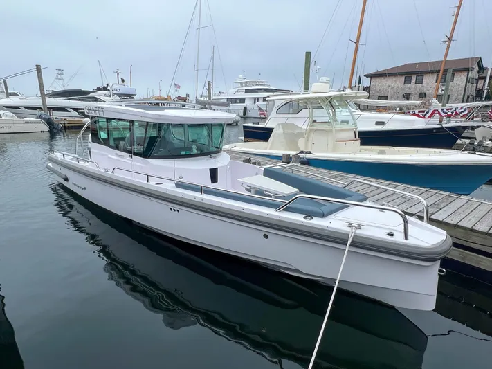 Girafft Yacht Photos Pics 2022 Axopar 28 Cabin Aft Cabin boat docked in a marina.