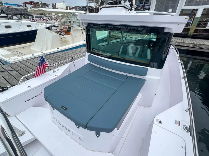 Girafft Yacht Photos Pics 2022 Axopar 28 Cabin Aft Cabin boat docked, featuring sleek design and spacious seating.