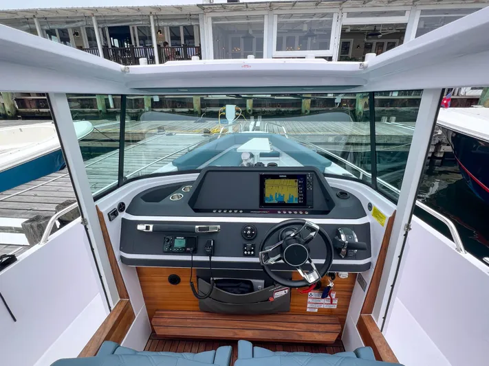 Girafft Yacht Photos Pics 2022 Axopar 28 Cabin Aft Cabin boat dashboard with modern navigation system.