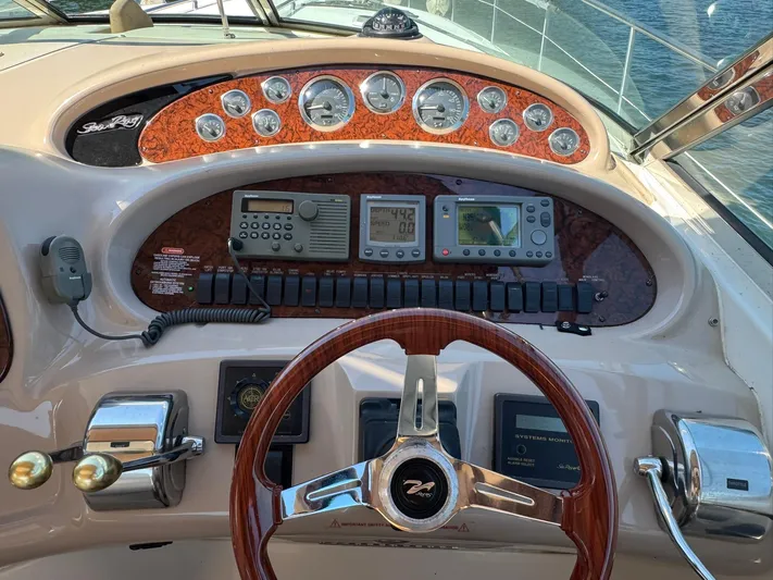  Yacht Photos Pics Control panel of a 2001 Sea Ray 380 Sundancer boat with gauges and navigation equipment.