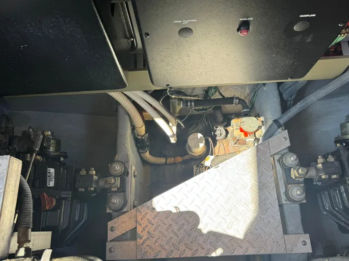  Yacht Photos Pics Engine compartment of a 2001 Sea Ray 380 Sundancer boat, showing mechanical components.