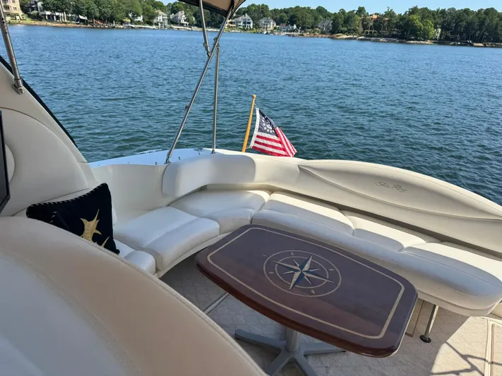  Yacht Photos Pics Luxurious 2001 Sea Ray 380 Sundancer yacht interior with lake view and American flag.