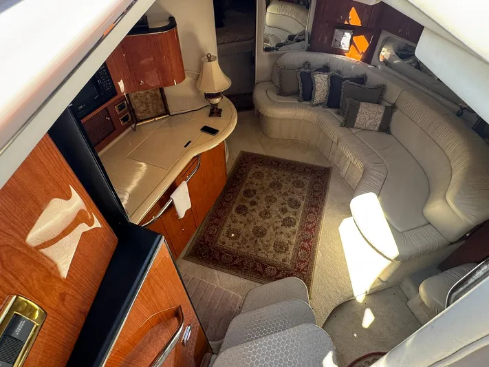  Yacht Photos Pics Interior of 2001 Sea Ray 380 Sundancer with elegant seating and wooden cabinetry.