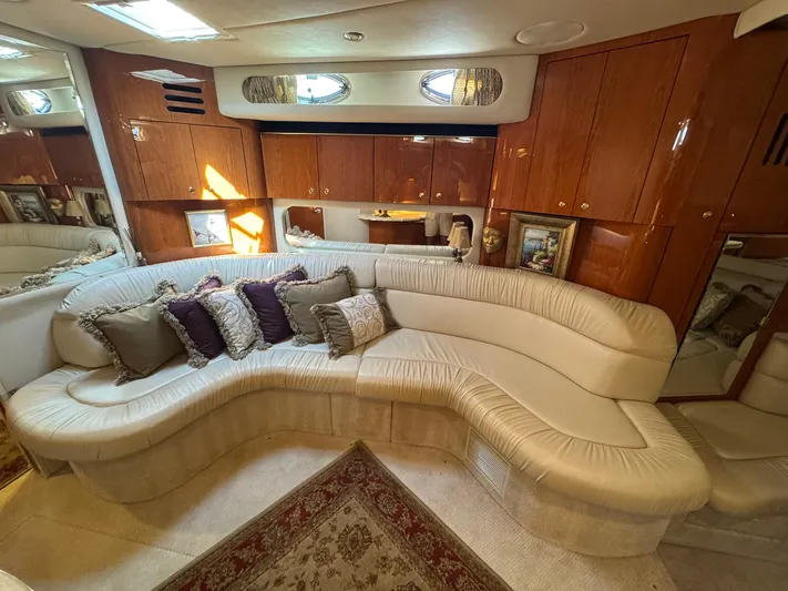  Yacht Photos Pics Luxurious interior of 2001 Sea Ray 380 Sundancer with plush seating and elegant wood cabinetry.