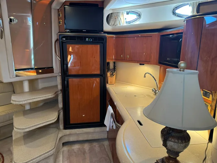  Yacht Photos Pics Interior of 2001 Sea Ray 380 Sundancer yacht with kitchen and stairs.
