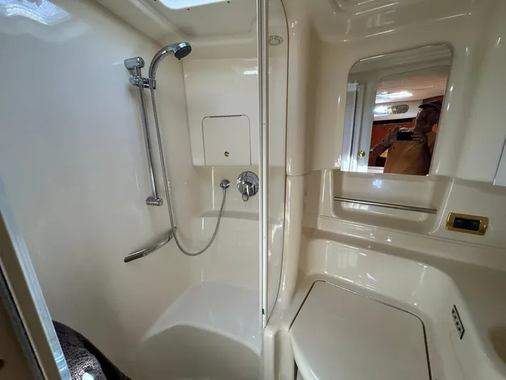  Yacht Photos Pics Bathroom interior of 2001 Sea Ray 380 Sundancer yacht, featuring shower and mirror.