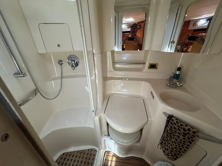  Yacht Photos Pics Bathroom interior of 2001 Sea Ray 380 Sundancer yacht, featuring shower and sink.