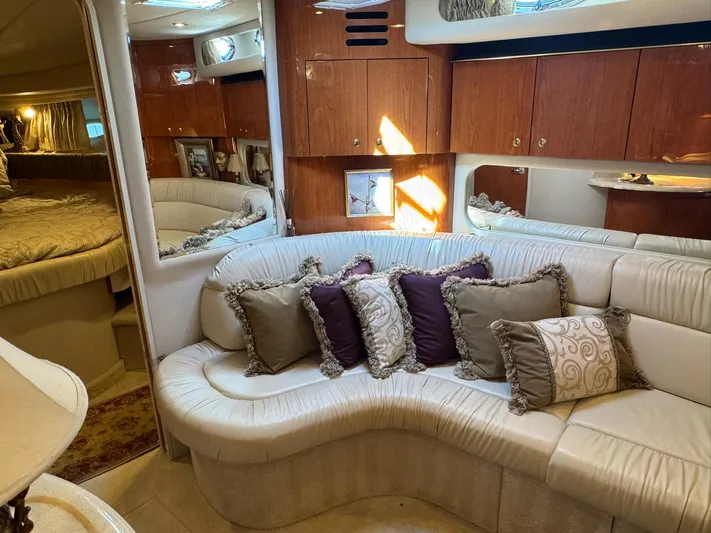  Yacht Photos Pics Luxurious interior of 2001 Sea Ray 380 Sundancer with plush seating and elegant decor.