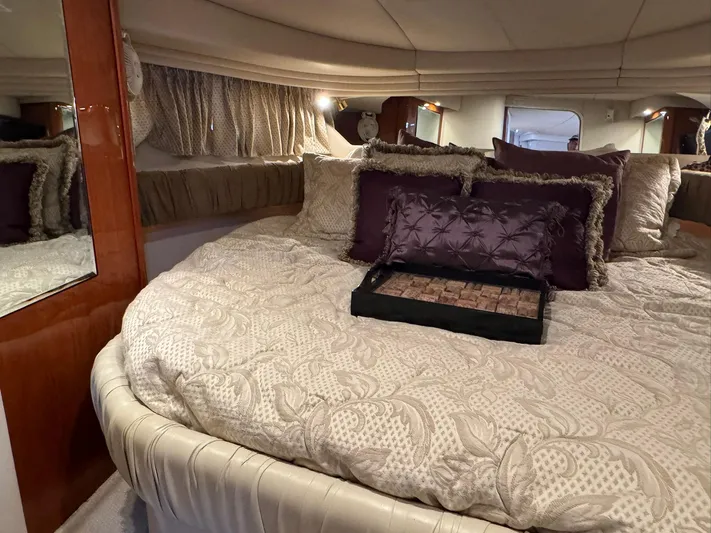  Yacht Photos Pics Luxurious bedroom interior of 2001 Sea Ray 380 Sundancer yacht with plush bedding.