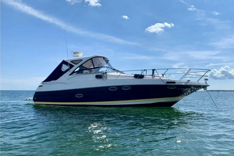  Yacht Photos Pics 2008 Regal Commodore 3760 IO yacht on calm blue water under clear sky.