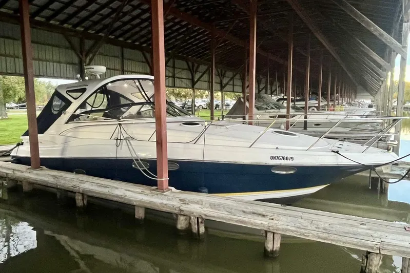  Yacht Photos Pics 2008 Regal Commodore 3760 IO docked under covered marina.