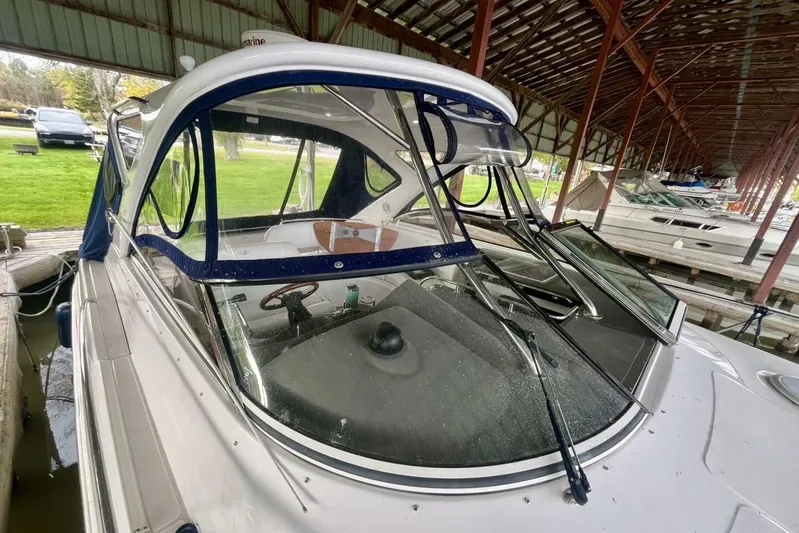  Yacht Photos Pics 2008 Regal Commodore 3760 IO boat docked under a covered marina.