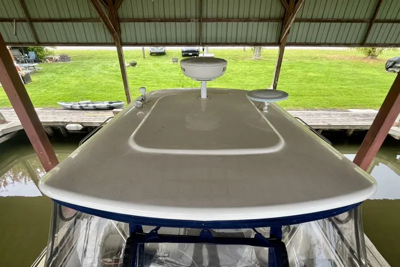  Yacht Photos Pics 2008 Regal Commodore 3760 IO boat under a covered dock, view of the roof and surroundings.